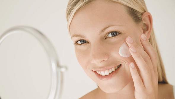 using a cream to rejuvenate facial skin